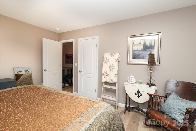 bedroom with light hardwood / wood-style flooring