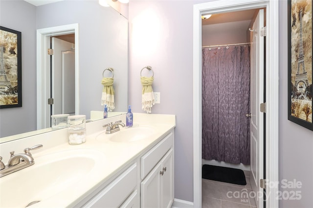 bathroom with tile patterned floors and vanity