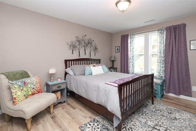 bedroom with light hardwood / wood-style floors