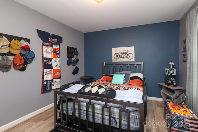 bedroom with hardwood / wood-style floors