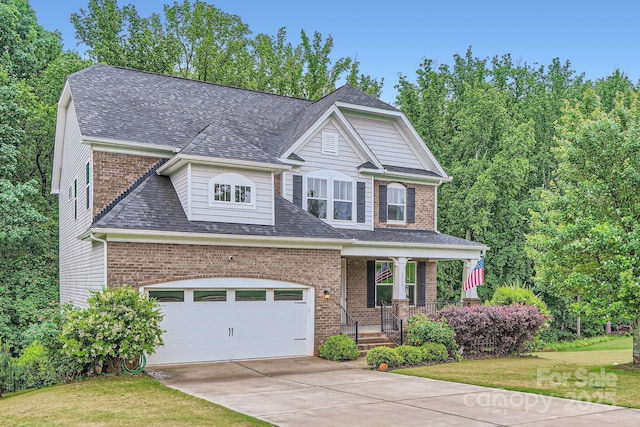2864 Park Ridge Blvd, Rock Hill, SC 29732 - view of front of house with covered porch, brick siding, driveway, and a shingled roof