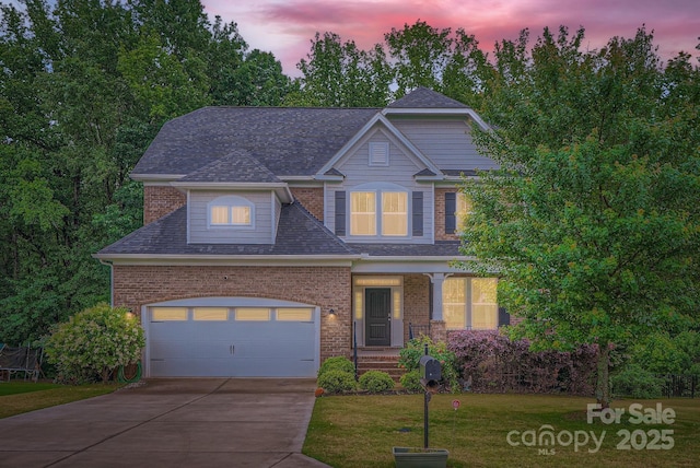 2864 Park Ridge Blvd, Rock Hill, SC 29732 - view of front of home featuring driveway, brick siding, a lawn, a shingled roof, and covered porch