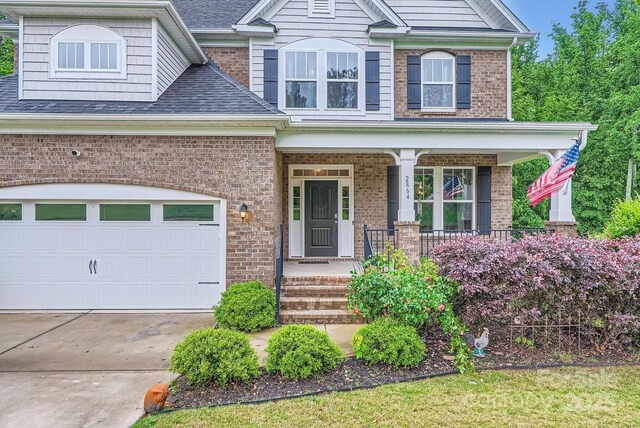 2864 Park Ridge Blvd, Rock Hill, SC 29732 - view of front of property featuring brick siding, covered porch, a garage, and driveway