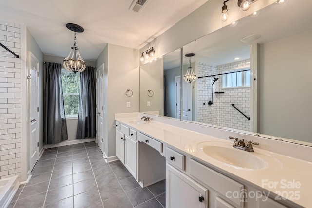 2864 Park Ridge Blvd, Rock Hill, SC 29732 - full bath featuring a tile shower, a chandelier, plenty of natural light, and double vanity