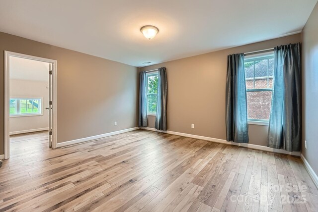 2864 Park Ridge Blvd, Rock Hill, SC 29732 - empty room with light wood finished floors, healthy amount of natural light, and baseboards