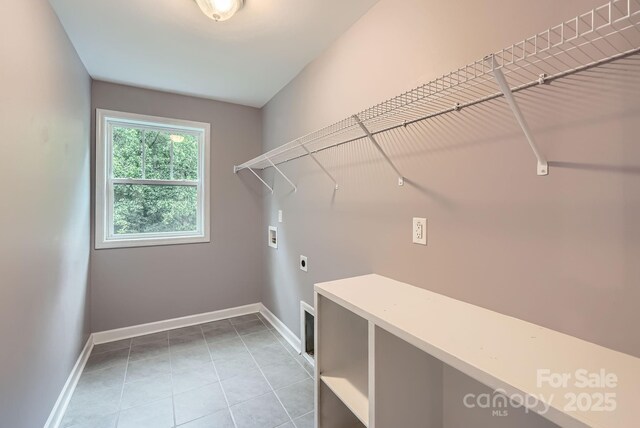 2864 Park Ridge Blvd, Rock Hill, SC 29732 - clothes washing area with hookup for an electric dryer, hookup for a washing machine, baseboards, and tile patterned floors