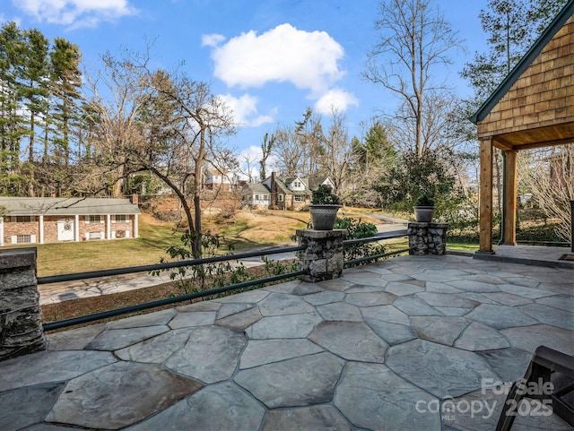 view of patio featuring an outdoor structure