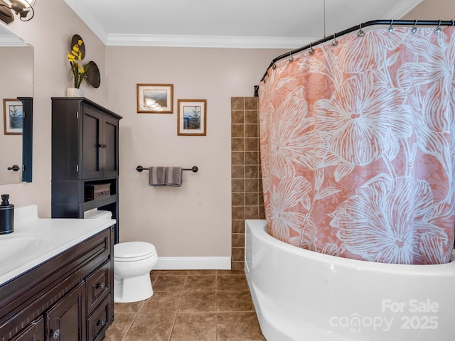 bathroom with tile patterned floors, ornamental molding, toilet, and vanity