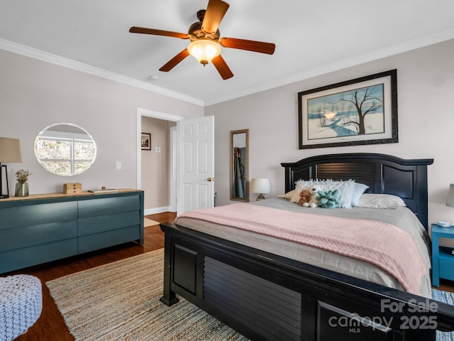 bedroom with dark wood-type flooring, ceiling fan, and ornamental molding