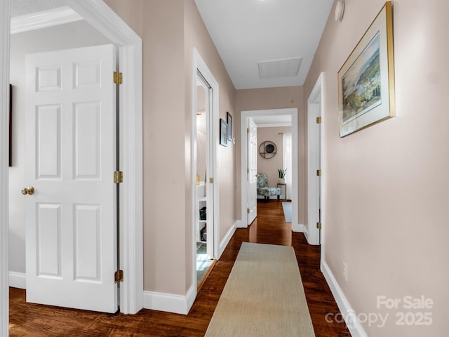 corridor with dark hardwood / wood-style floors