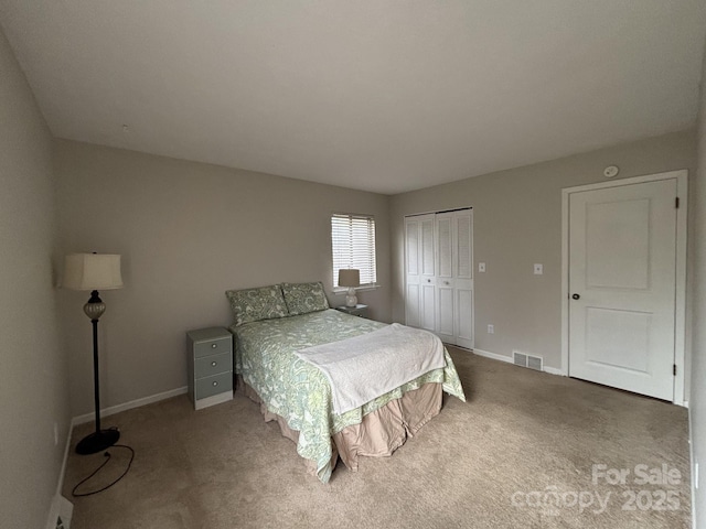 bedroom with carpet floors and a closet