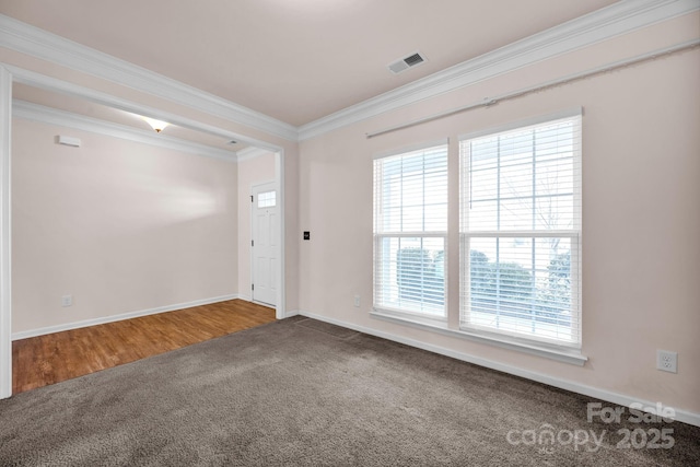 carpeted empty room featuring ornamental molding