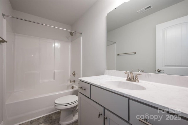 full bathroom featuring shower / tub combination, vanity, and toilet