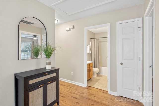 hall with light hardwood / wood-style flooring