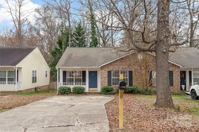 ranch-style house featuring covered porch