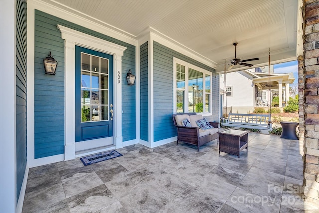 view of patio / terrace featuring ceiling fan and covered porch