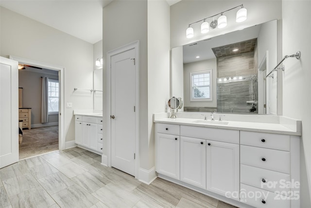 bathroom featuring vanity and a tile shower