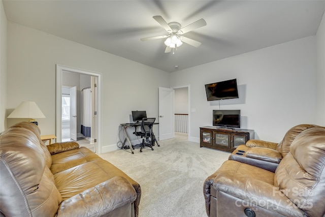 carpeted living room featuring ceiling fan