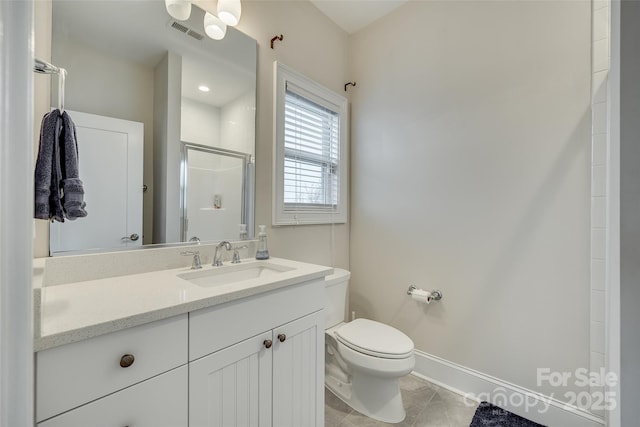 bathroom featuring walk in shower, vanity, toilet, and tile patterned flooring