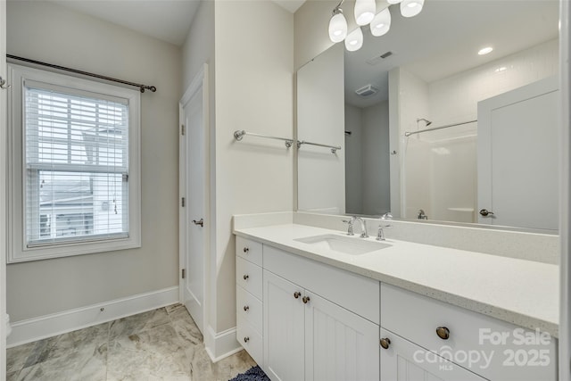 bathroom featuring vanity and walk in shower