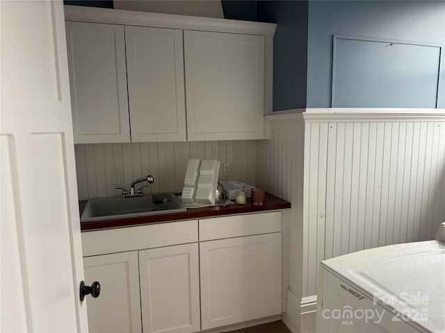 kitchen with white cabinetry and sink