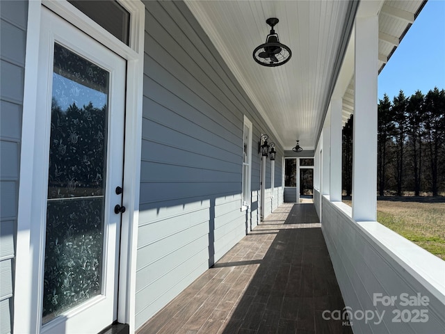 wooden terrace with a porch