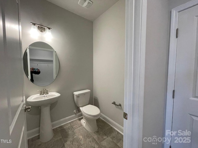 bathroom featuring sink and toilet