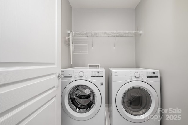 washroom featuring independent washer and dryer