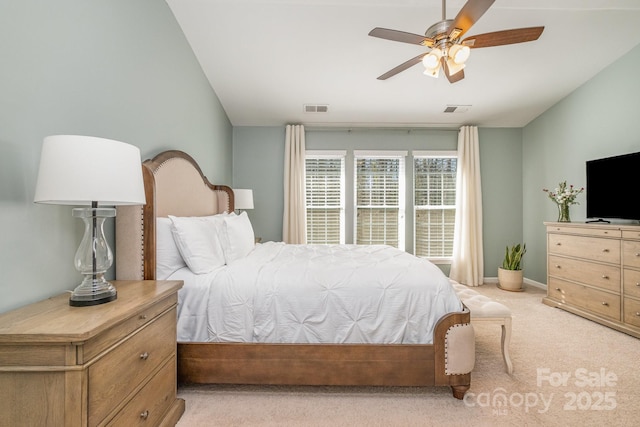 carpeted bedroom featuring vaulted ceiling and ceiling fan