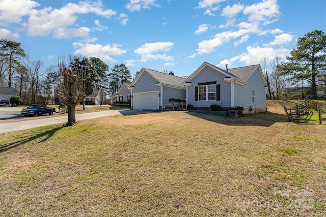 view of front of house featuring a garage and a front yard