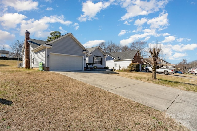 ranch-style house featuring a garage and a front yard