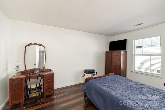 bedroom featuring dark wood-type flooring