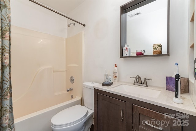 full bathroom with vanity, toilet, and shower / bath combo with shower curtain