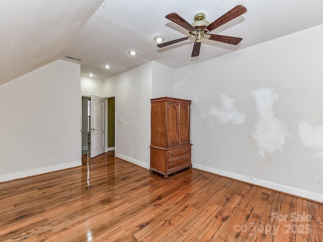 interior space featuring lofted ceiling, hardwood / wood-style floors, and ceiling fan