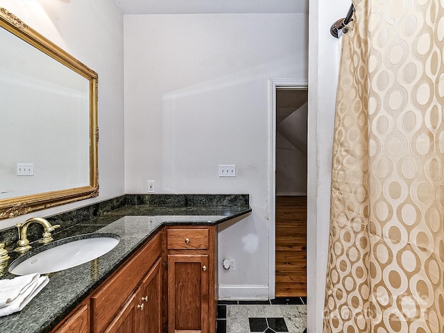 bathroom featuring tile patterned flooring and vanity