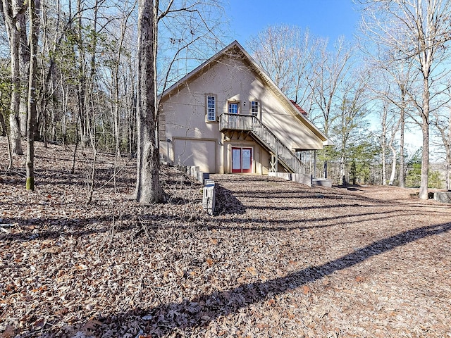 back of property with a wooden deck