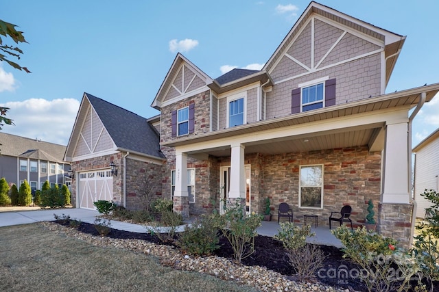 craftsman-style home featuring a garage and covered porch