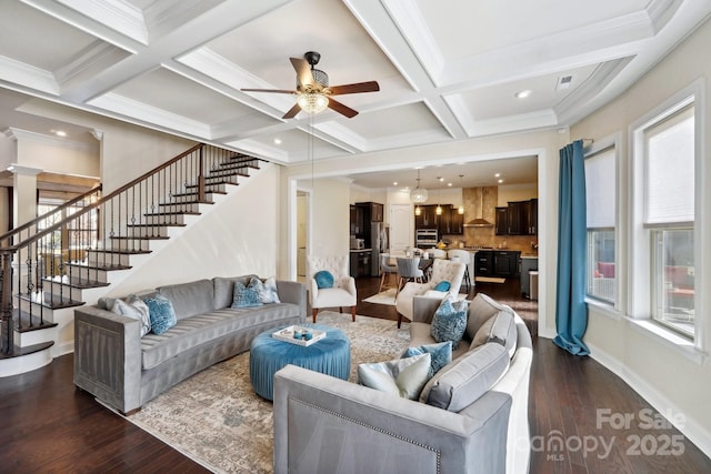 living room with coffered ceiling, beamed ceiling, dark hardwood / wood-style floors, and a healthy amount of sunlight