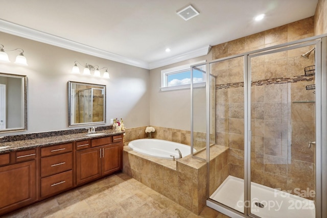 bathroom featuring independent shower and bath, ornamental molding, and vanity