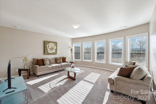 carpeted living room featuring a healthy amount of sunlight