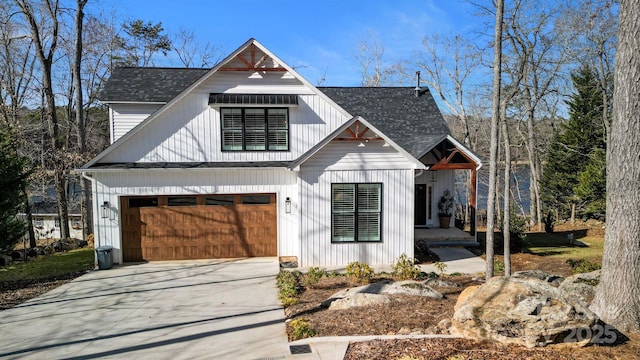 modern inspired farmhouse with a garage