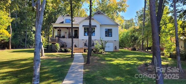 view of front facade featuring covered porch and a front lawn