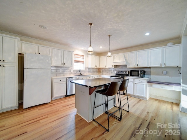 kitchen featuring white cabinetry, appliances with stainless steel finishes, and sink