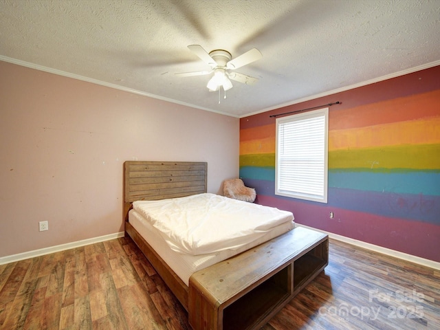 bedroom featuring hardwood / wood-style flooring, ceiling fan, crown molding, and a textured ceiling