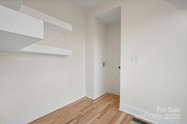 unfurnished room with light hardwood / wood-style floors