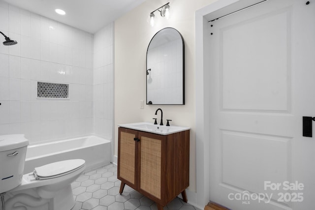 full bathroom with tiled shower / bath combo, vanity, tile patterned flooring, and toilet