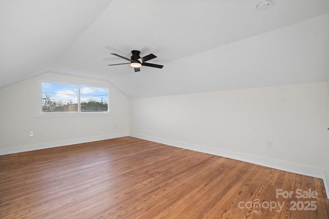 bonus room featuring vaulted ceiling, hardwood / wood-style floors, and ceiling fan