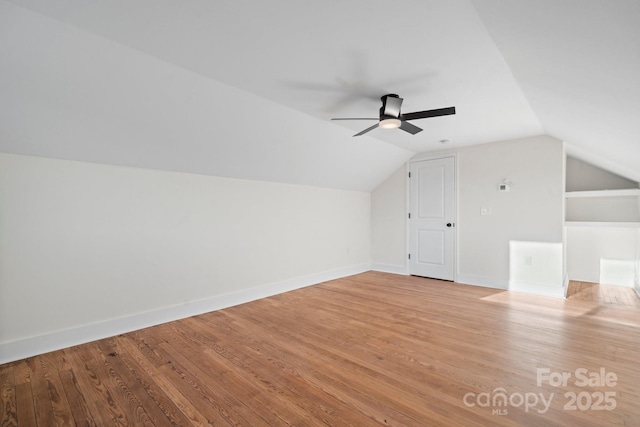 additional living space featuring lofted ceiling, ceiling fan, and light hardwood / wood-style flooring