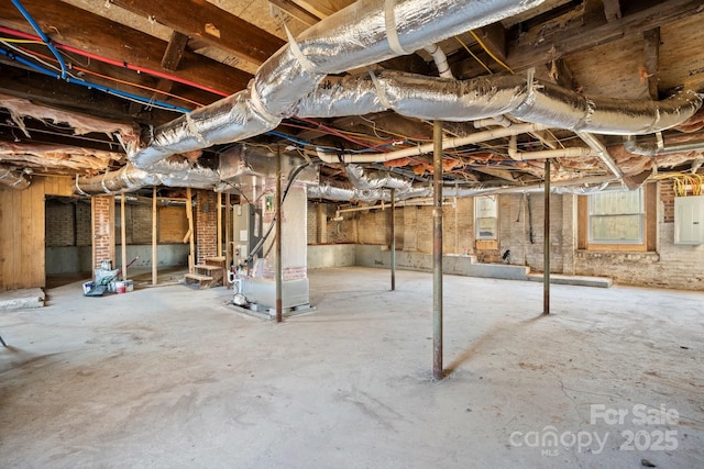 basement with heating unit and electric panel