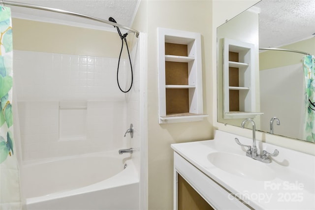 bathroom with vanity, a textured ceiling, and shower / tub combo with curtain